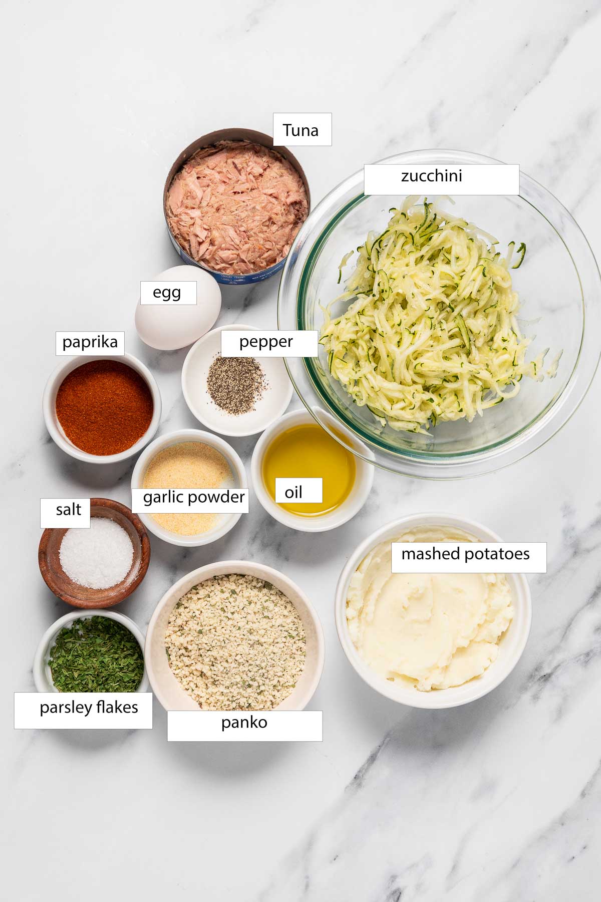 Ingredients of tuna potato patties on a counter top