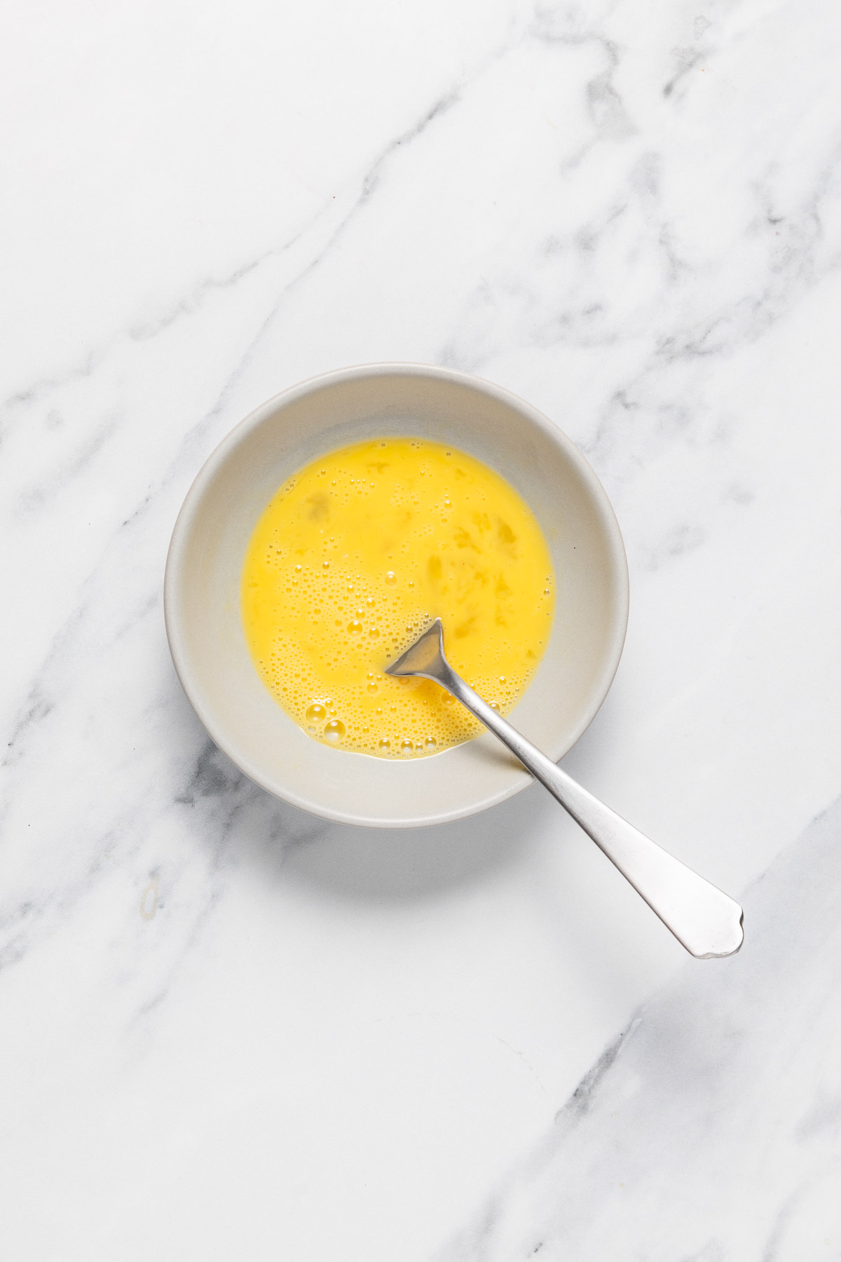lightly beaten egg in a small bowl