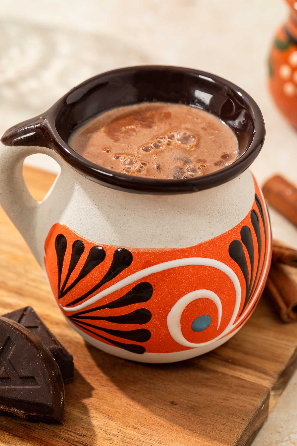 champurrado in a much ready to be serve with mexican chocolate peaking into frame
